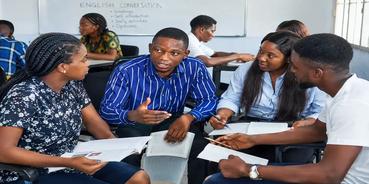 Nigerian learners practicing English conversation in a group